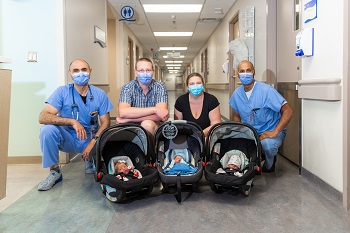 Photo of Dr. Amir Elmekkawi, James, Stephanie, Dr. Gregory Athaide, and the triplets