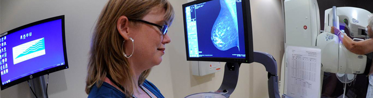 technician performing a mammogram