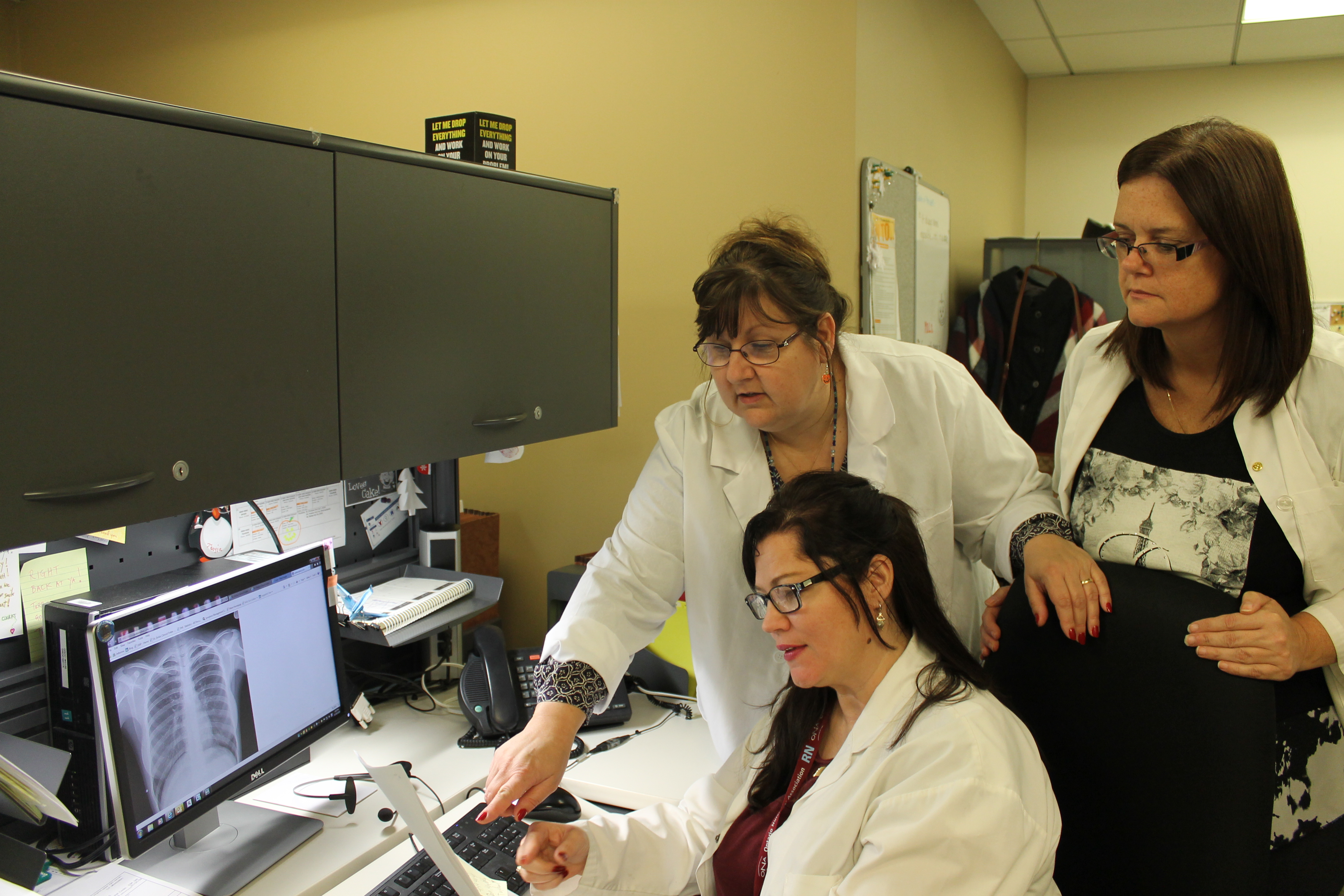 nurses working at a computer