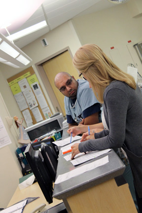 Critical Care staff talking at the team centre