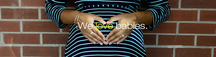 Woman with hands on stomach with text We love babies