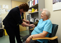 nurse taking a patient's blood pressure