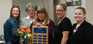 Woman receiving Family Centered Care Award 