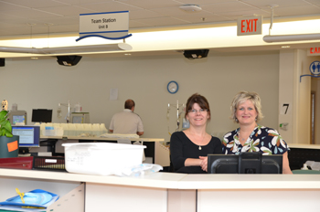 two nurses at a nursing station