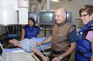 a doctor and two nurses with a patient 