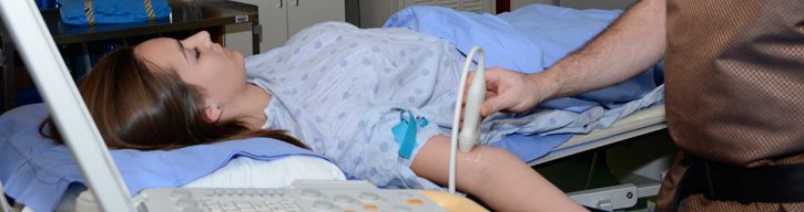 woman on a stretcher having procedure