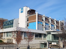 Before Photo showing Ajax Hospital's brick siding